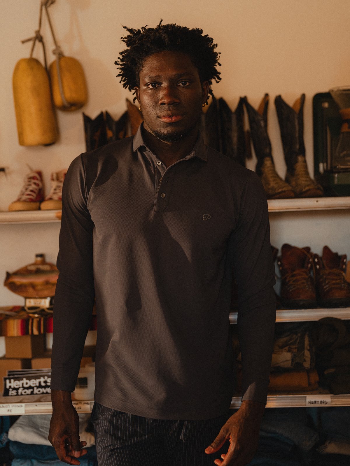 A man in the dark slate Triborough Waffle Knit Polo