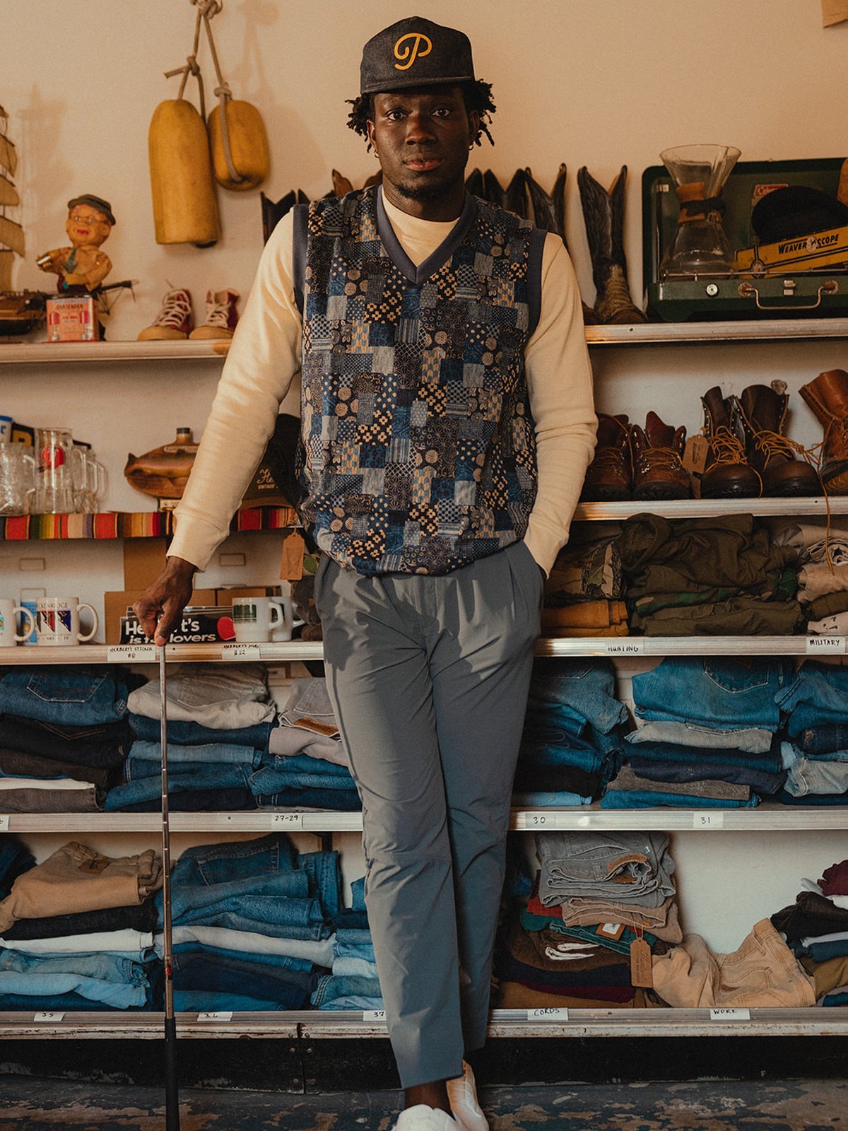 A man in the patchwork swing vest over a cream long-sleeve, from the Akashi-Kama shoot