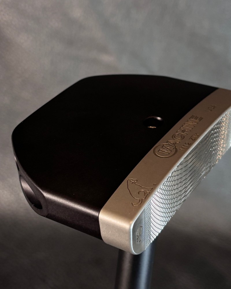 A close view of the milled face and copper accent on the Machine M12 ZTX