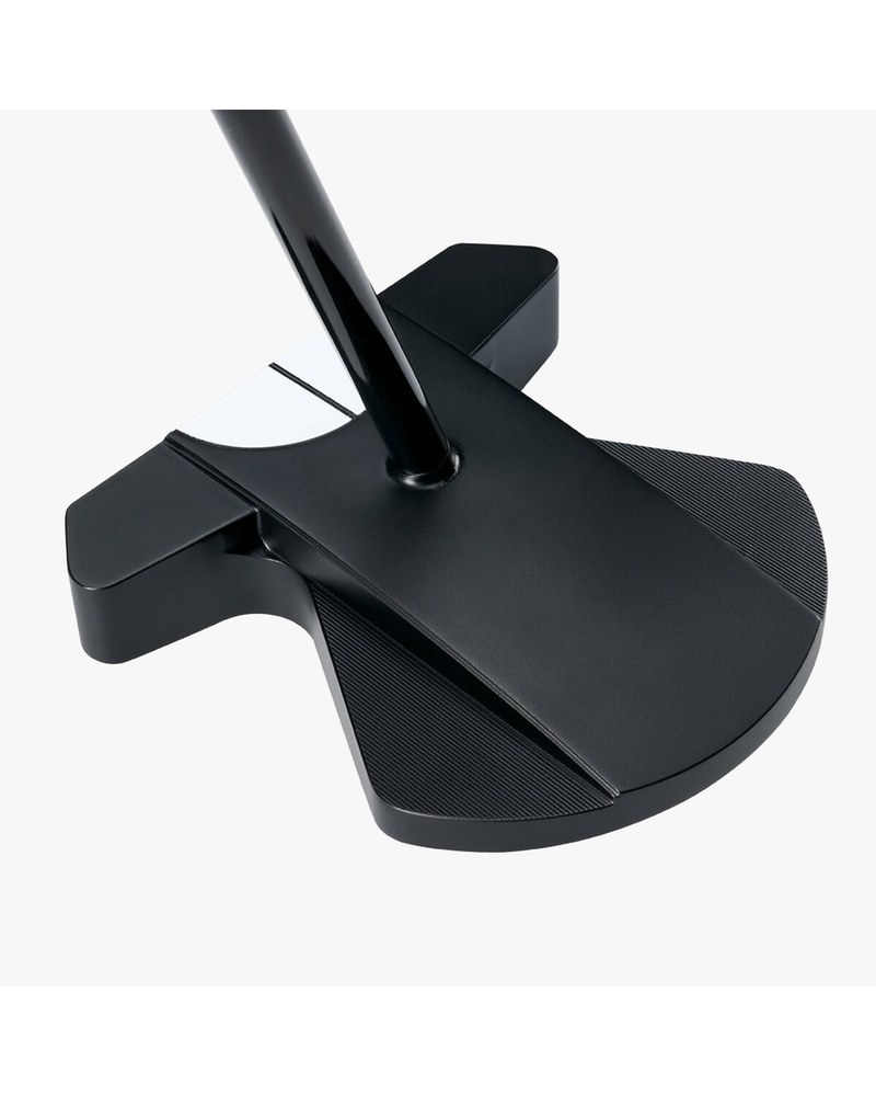 The Odyssey Ai-DUAL broomstick putter head behind a golf ball on a putting green