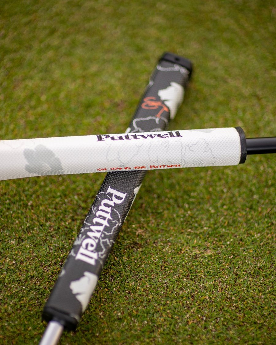 A Puttwell putter grip lying on the green