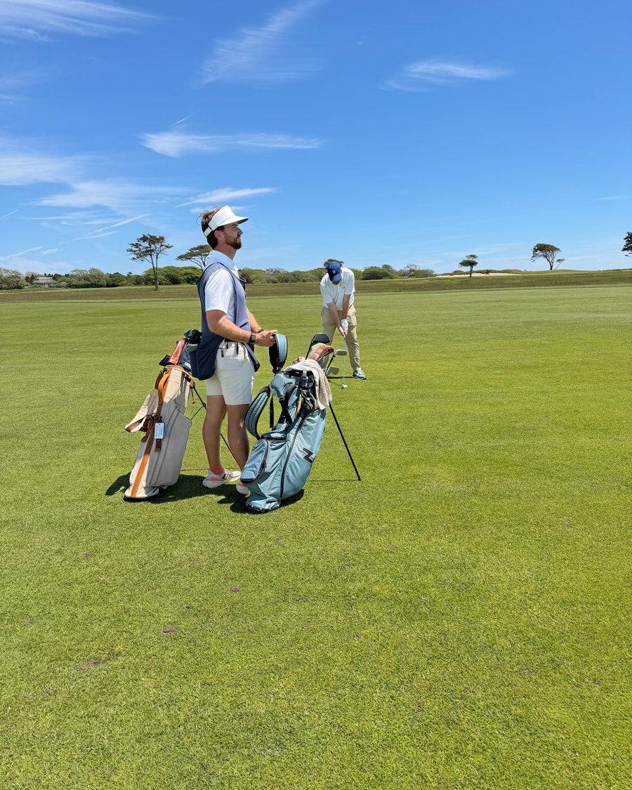 Two golfers with carry bags on a fairway at Maidstone