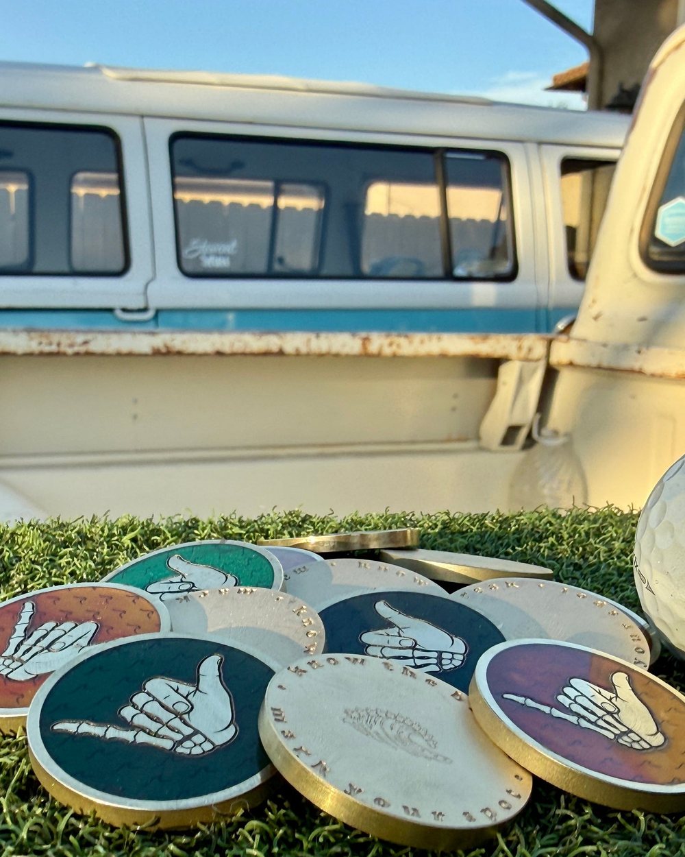 Swell Marks Good Bones shaka markers in green, blue and orange resin on the grass with an old truck behind