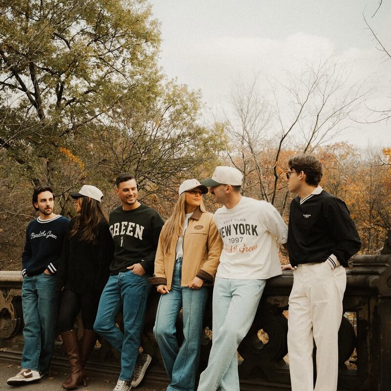 The RTG crew in Central Park — knits, tees, and Founder's Caps — @readthegreen_