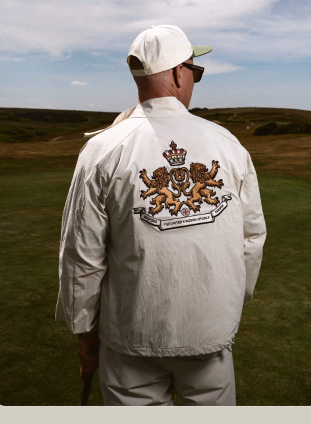 Harrington Jacket with The United Kingdom of Golf crest on the back, worn on a links course