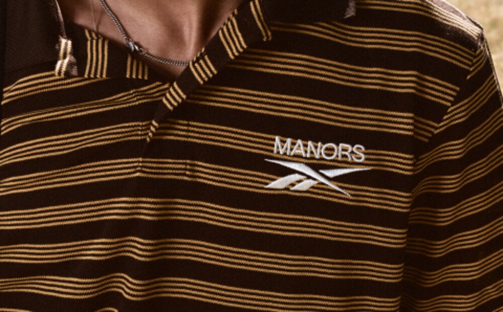 Brown striped Reebok x Manors polo collar detail