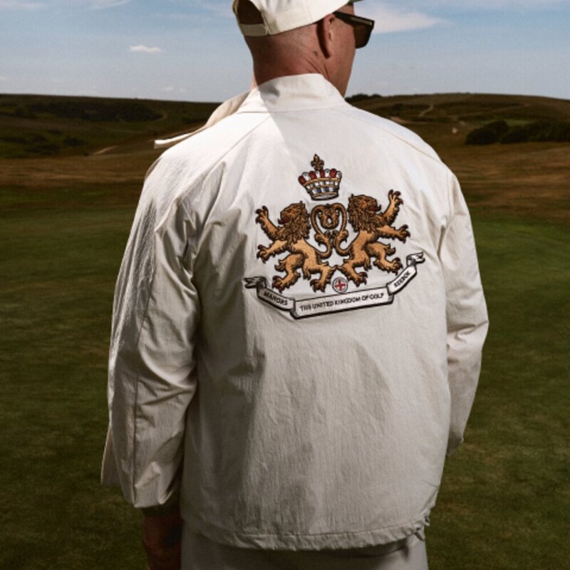 Harrington Jacket with The United Kingdom of Golf crest on the back, worn on a links course