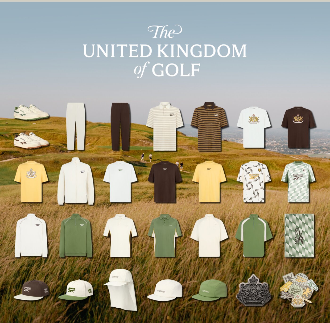 The full Reebok x Manors II collection laid out on links grass — shoes, pants, polos, tees, jerseys, pullovers, caps, ball marker, and stickers under The United Kingdom of Golf title