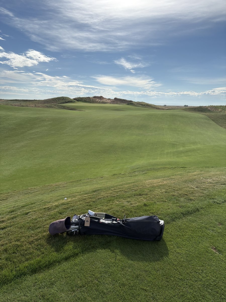 Golf bag resting on a sweeping Rodeo Dunes fairway with 90-foot dunes in the background