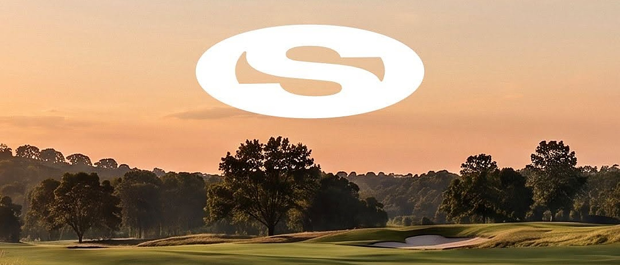 The white Saha oval logo floating over a golf course at sunset, from Saha’s Instagram