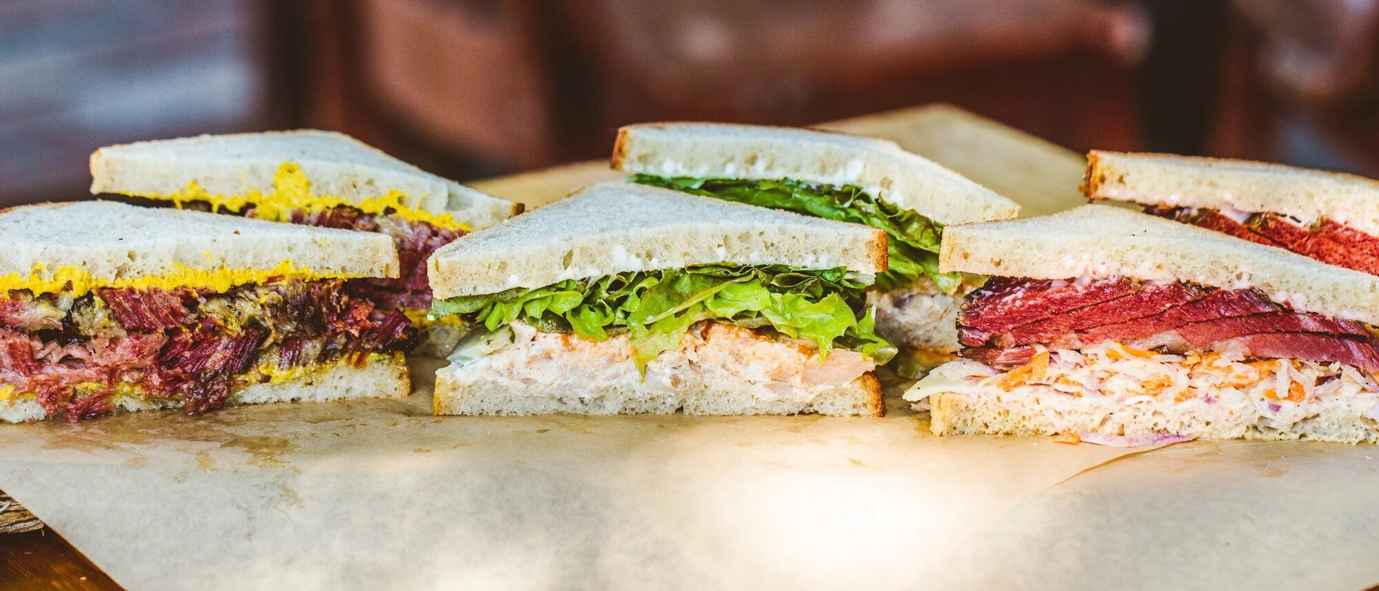 Mum Foods sandwiches — pastrami, salad, and the Rachel — before the round in Austin
