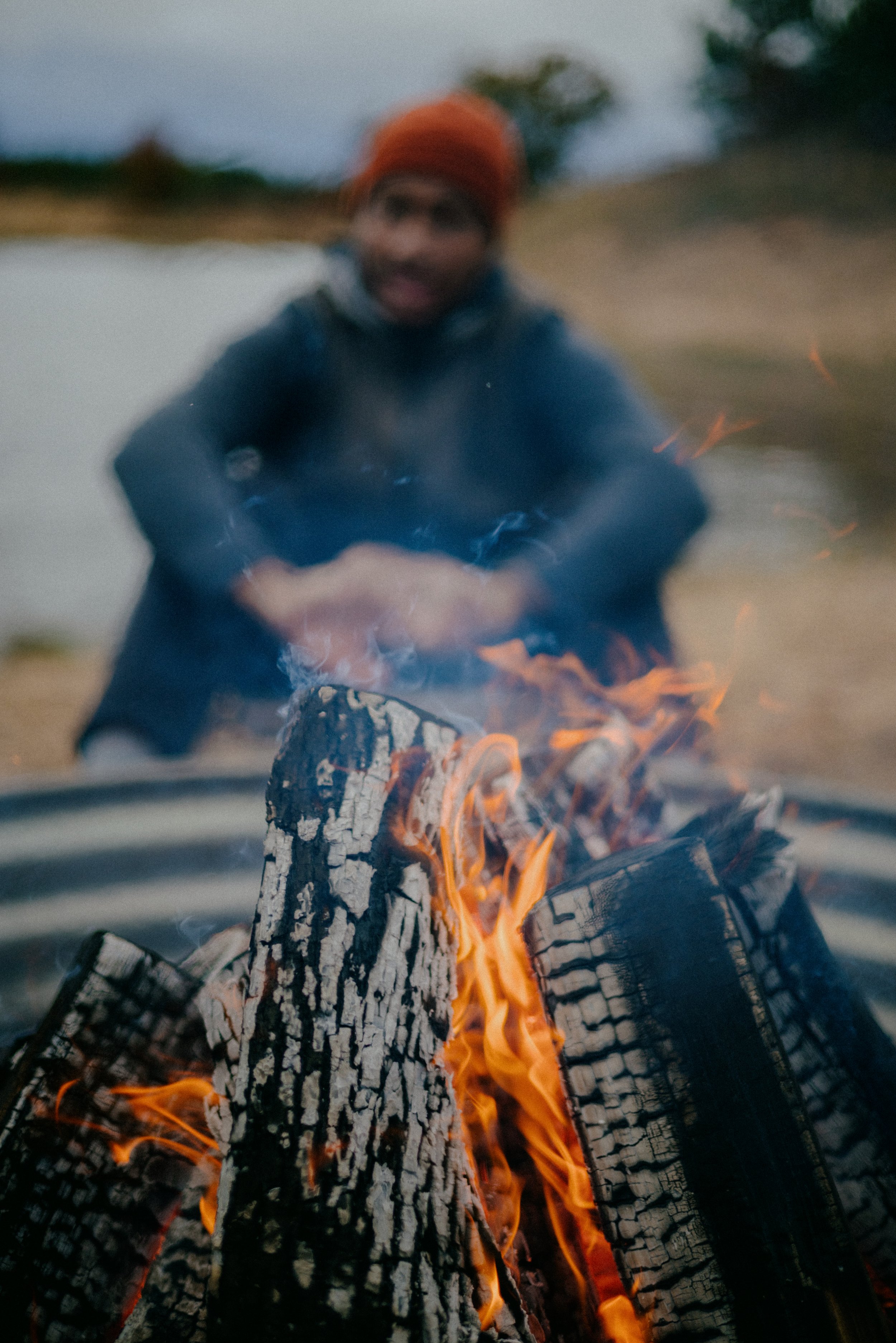 Sitting out a fire on the water at dusk in a Sentinel shell
