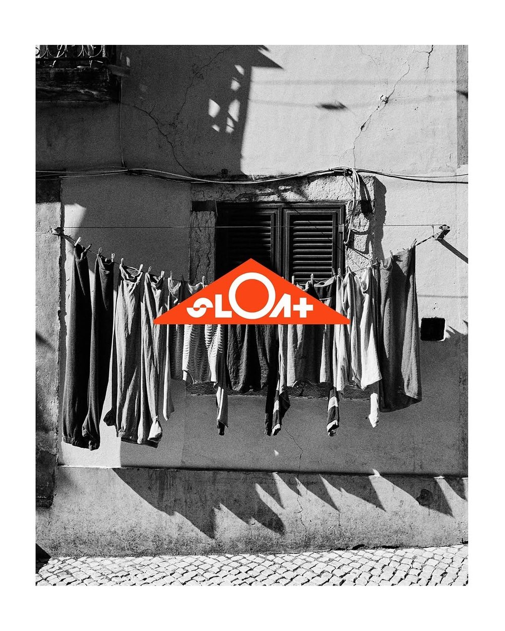 A laundry line hung with shirts under the SLOAT logo, from the founders’ trip to Portugal