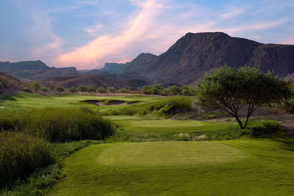 A green under desert cliffs at Lajitas, Black Jack's Crossing