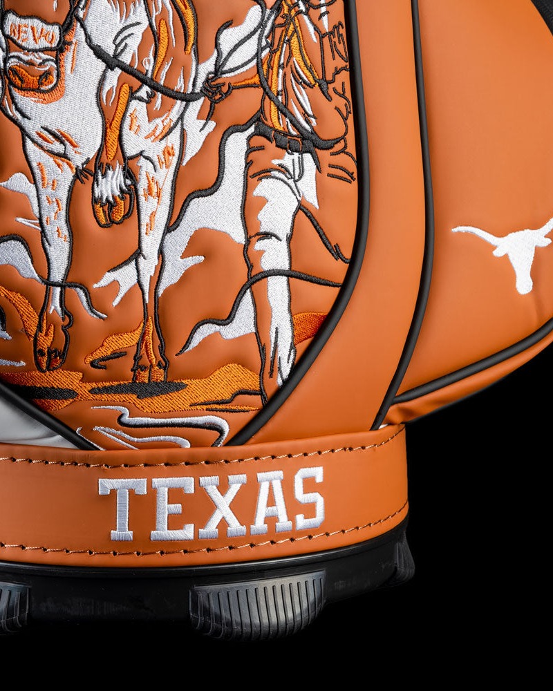 Detail of the Swag Golf Texas Longhorns Den Caddy cooler, TEXAS in white script below a longhorn-rider illustration in burnt orange