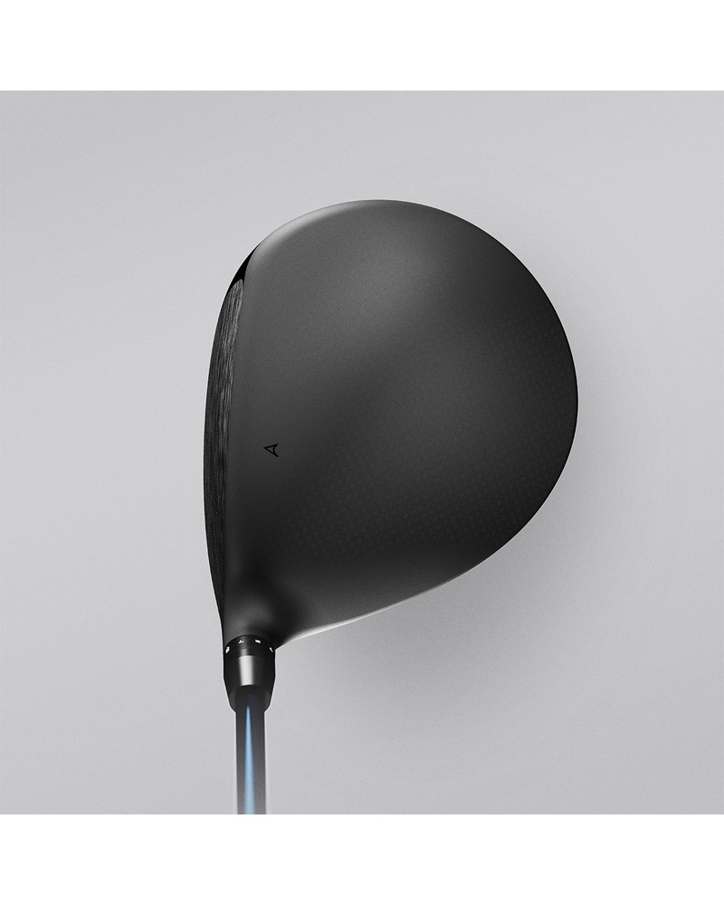 A golfer walking with the Takomo Ignis D1 driver over one shoulder