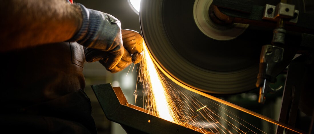 A Texas club maker grinding a forged wedge head