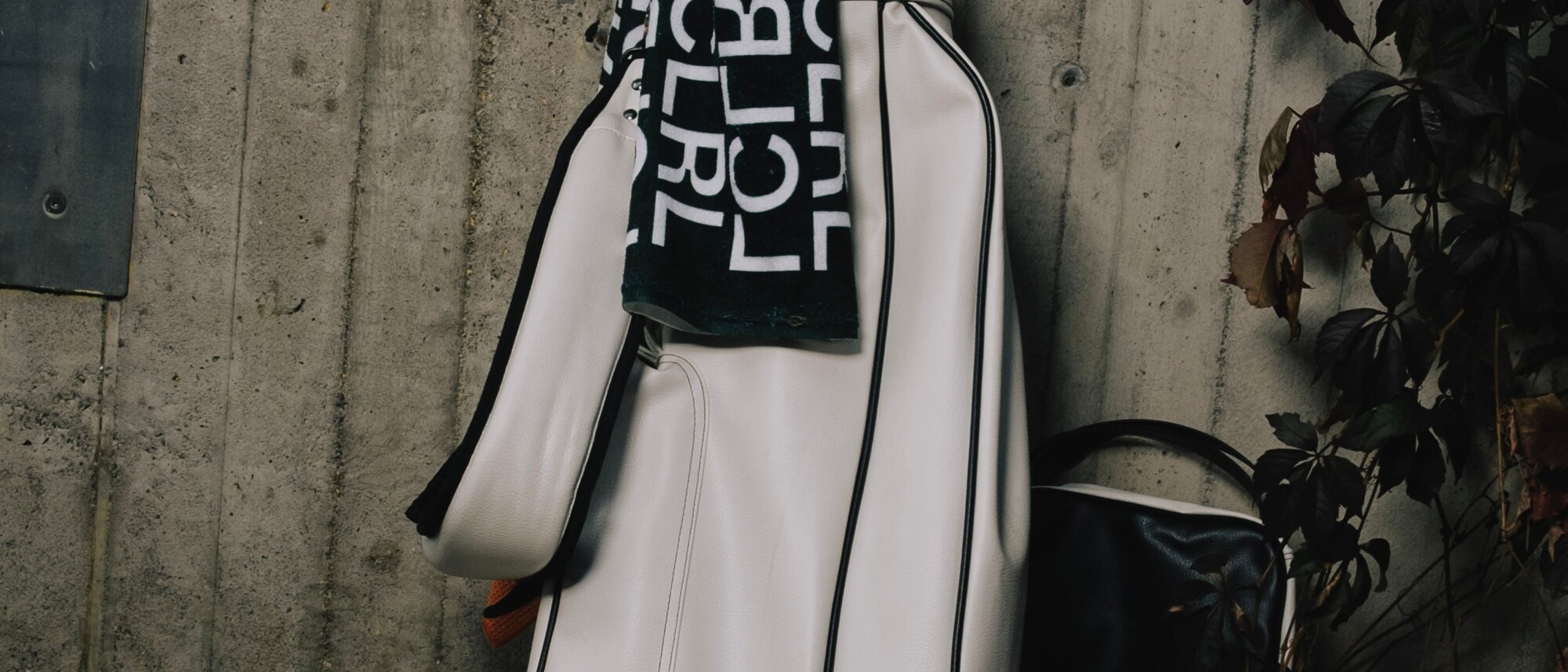 The Towel Edit Vol. 3 — Local Rule LCLRL towel draped over a white golf bag against a concrete wall