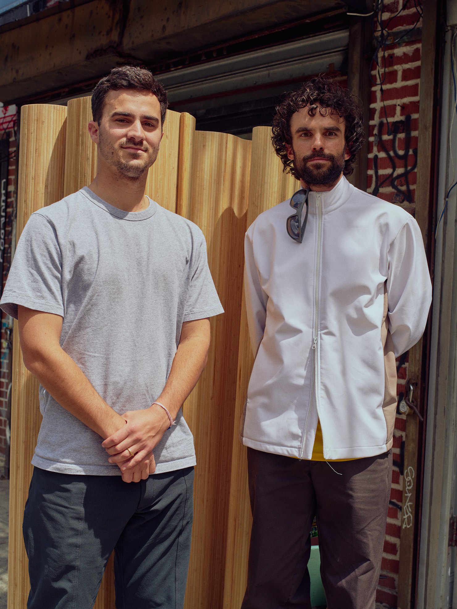 Colin Heaberg and Will Gisel standing outside Whim's Free Golf shop in New York